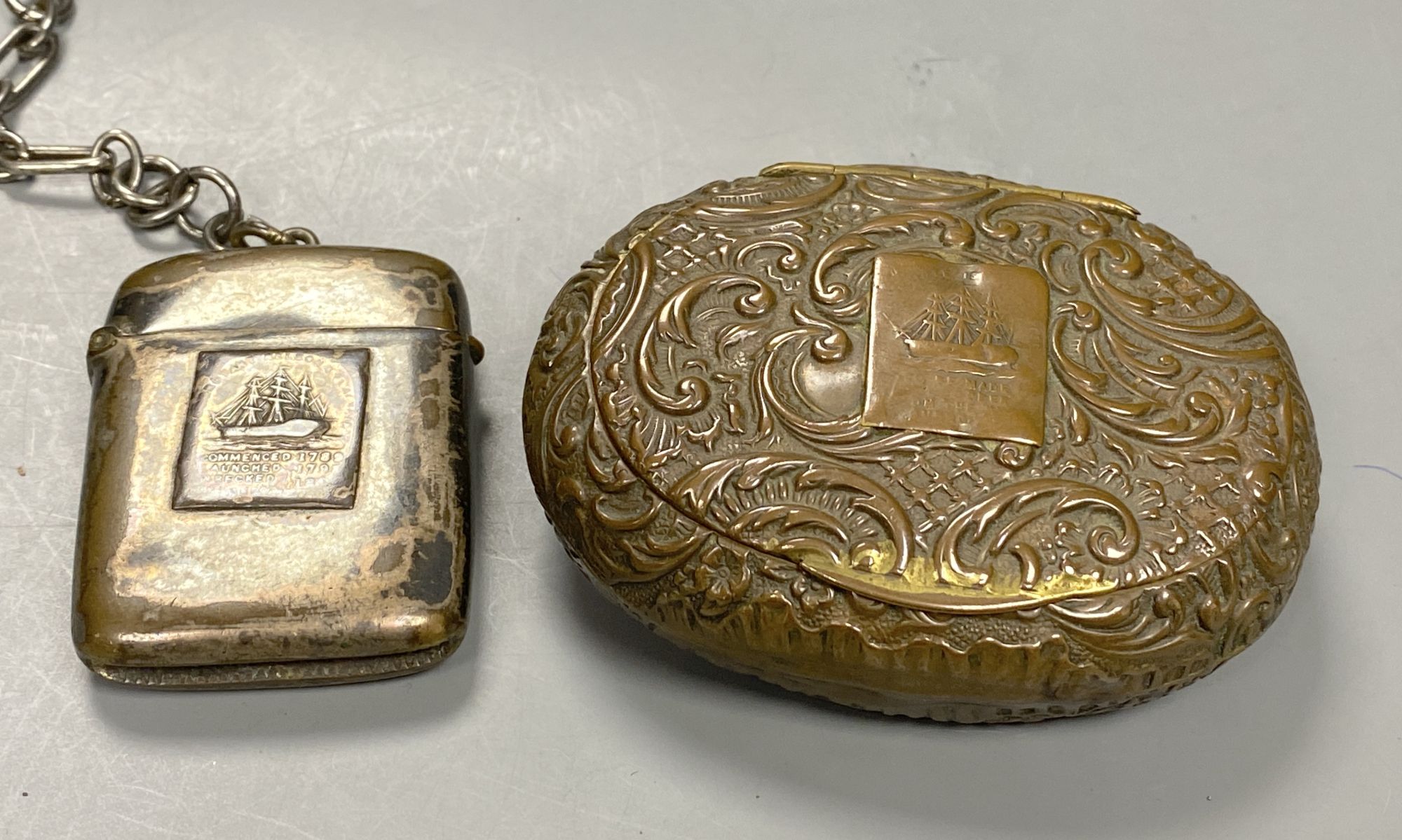 A Victorian oval commemorative snuff box, made from copper from HMS Foudroyant and a similar silver on copper vesta and chain